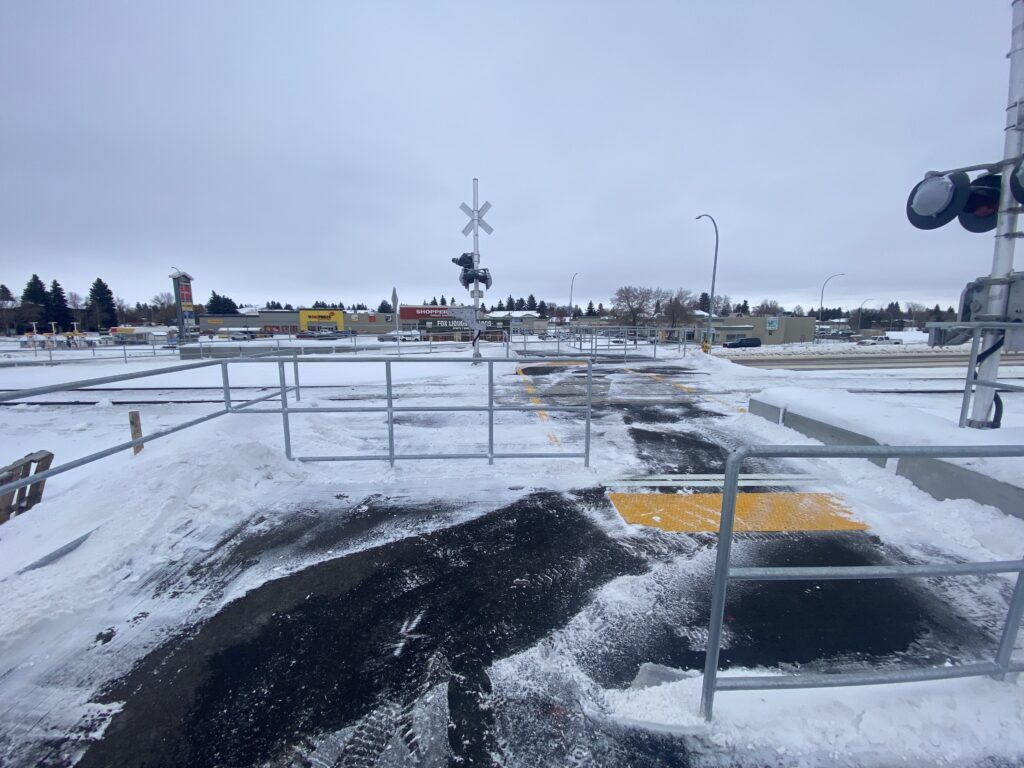 Pedestrian-activated rail crossing at Assiniboine and Warman